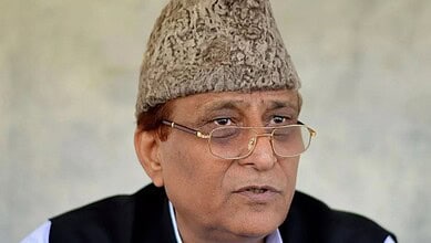 Men wearing glasses and a wool hat, speaking in an interview or speech.