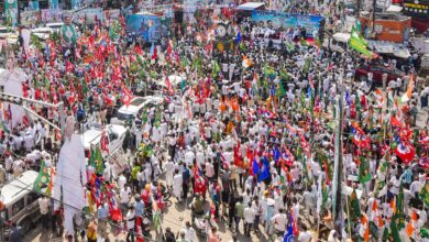 People gather during a march marking culmination of 'Vote Adhikar Yatra' in Patna on Monday. (PTI Photo)