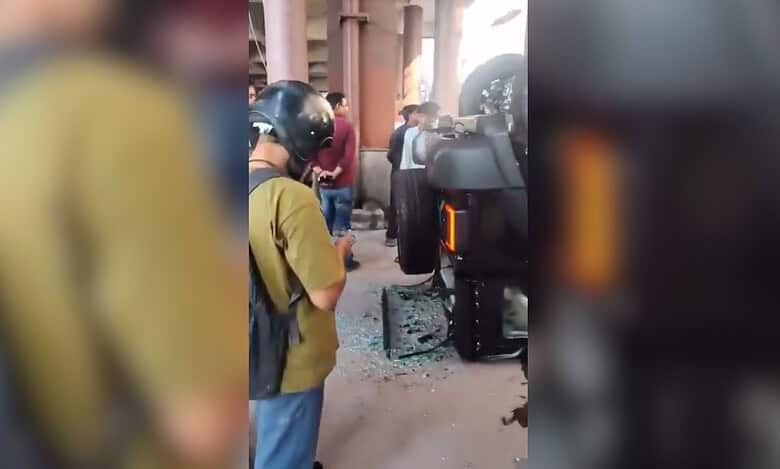 Woman drives car out of showroom's first floor in Delhi