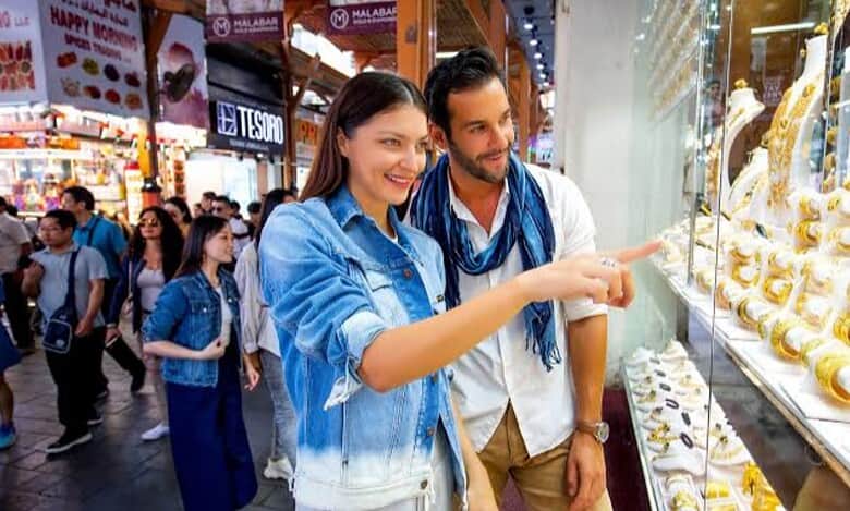Couple shopping for gold jewellery in Dubai gold souk.