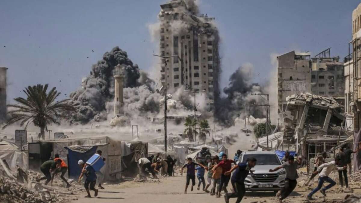 Palestinians flee as an Israeli airstrike destroys a high-rise building in Gaza City, with smoke and debris filling the streets.