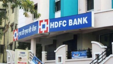 Exterior view of an HDFC Bank branch in India with bilingual signage in English and Hindi.