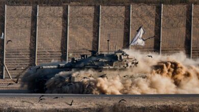 Israeli tank manoeuvring near the Gaza border, raising dust and flying a flag, September 17, 2025.