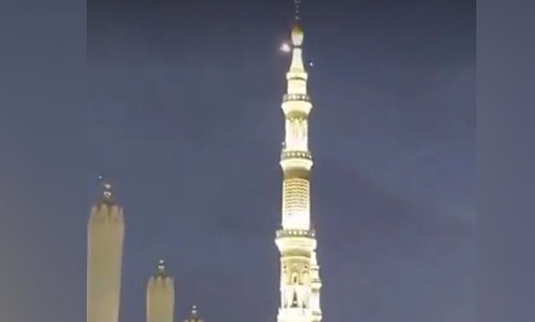 Minaret of the Prophet’s Mosque in Madinah at night with a light in the sky, linked to interception of an unauthorised drone.