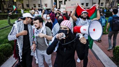 Pro-Palestinian demonstrators protest with keffiyehs and signs at Columbia University, New York, on October 12, 2024.