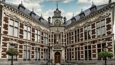 Historic main building of Utrecht University with ornate architecture and symmetrical design.