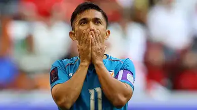 Indian Footballer dejected on the football field
