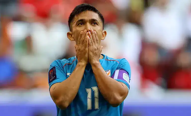 Indian Footballer dejected on the football field