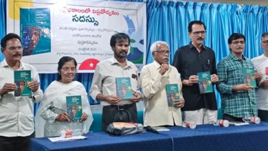 The image shows activists releasing a book titled "Shanthi Charchalu, Prajaswamyam- Viplavodyamam- Vadopavadala Kalabotha" authored by Pani at the Sundarayya Vignana Kendram in Baghlingampally on Monday, October 13, 2025.