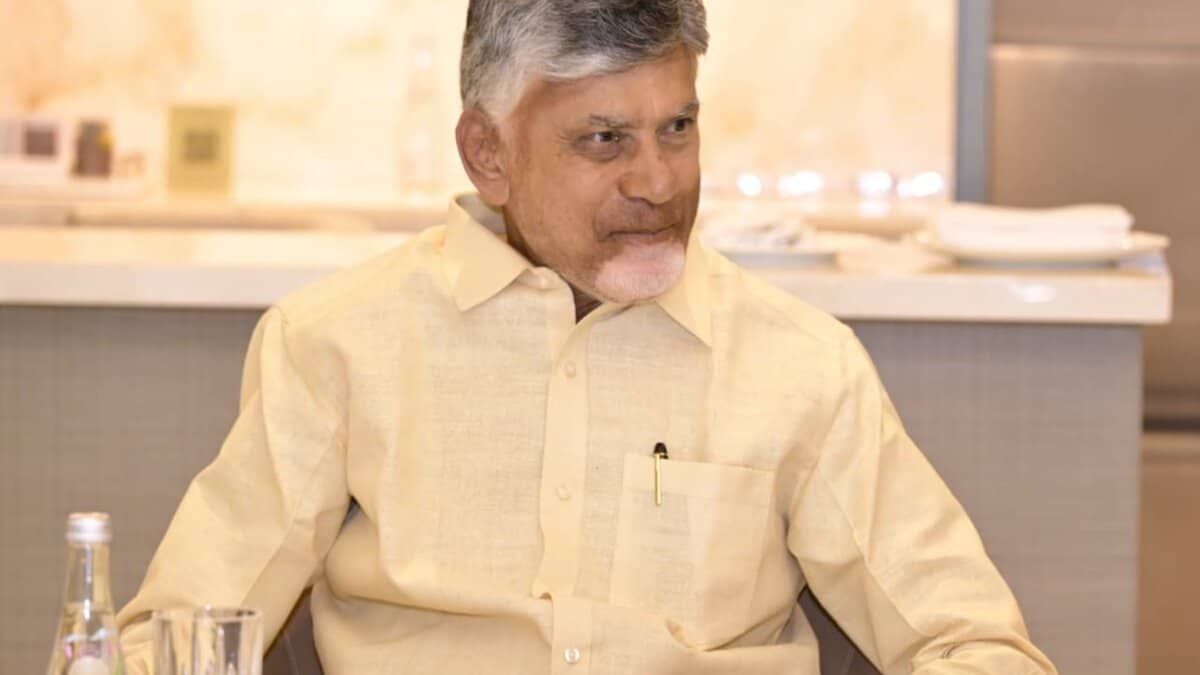 Andhra Pradesh Chief Minister N Chandrababu Naidu seated at a table during his UAE visit.