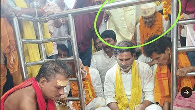 Photo of political strategist Prashant Kishor and a Muslim candidate sitting inside the temple's sanctum, which later caused a controversy and led to the sanctum being cleaned.