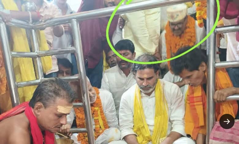 Photo of political strategist Prashant Kishor and a Muslim candidate sitting inside the temple's sanctum, which later caused a controversy and led to the sanctum being cleaned.