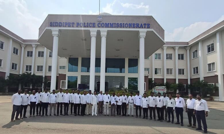 The image shows advocates from Siddipet protesting with black badges in front of Siddipet Police Commissionerate recently, demanding action against two advocates who allegedly insulted the Chief Justice of India BR Gavai in a WhatsApp group of advocates.