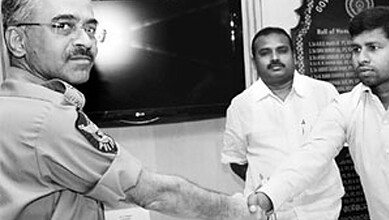 The image shows Azad surrendering before AP DGP in 2011.