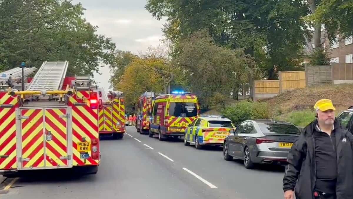 Police vehicles line up at the Synagogue in Manchester after a stabbing incident