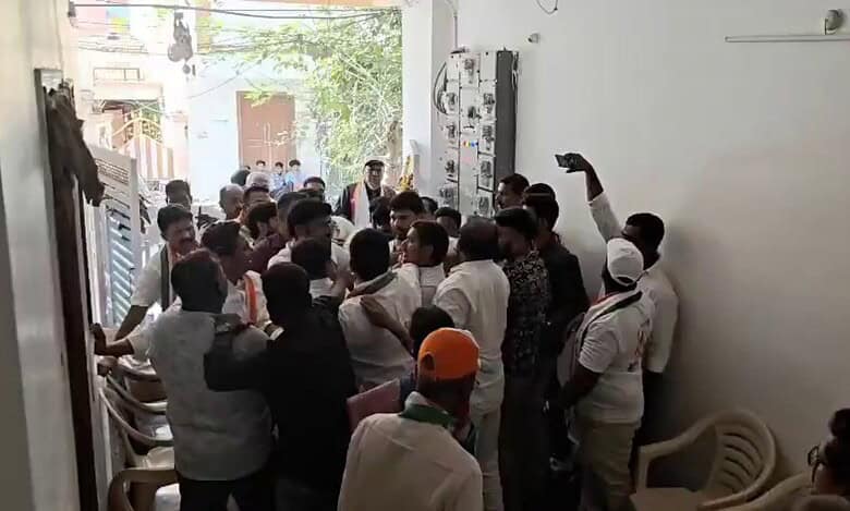 Congress workers grab each other collars during the bypoll campaign at Rahmathnagar area on Tuesday