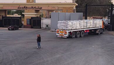 Trucks carrying humanitarian aid enter Gaza through the Rafah crossing on the Egypt side during a ceasefire between Israel and Hamas.