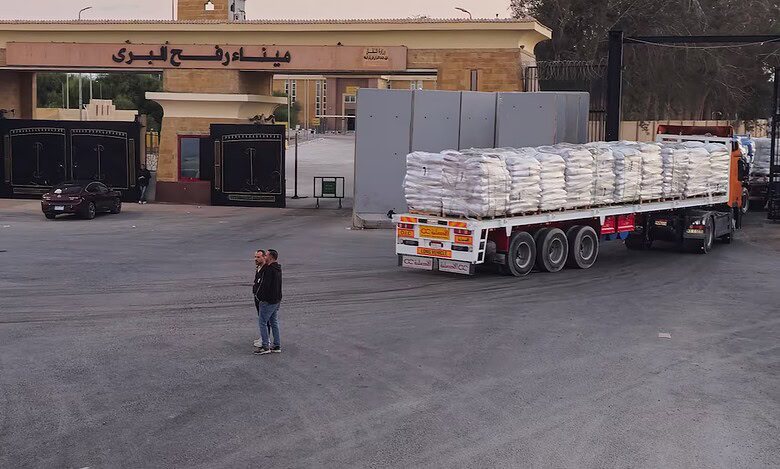 Trucks carrying humanitarian aid enter Gaza through the Rafah crossing on the Egypt side during a ceasefire between Israel and Hamas.
