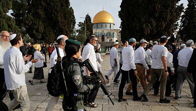 Israeli police escort Jewish settlers during a visit to the Al-Aqsa Mosque compound in Jerusalem’s Old City.