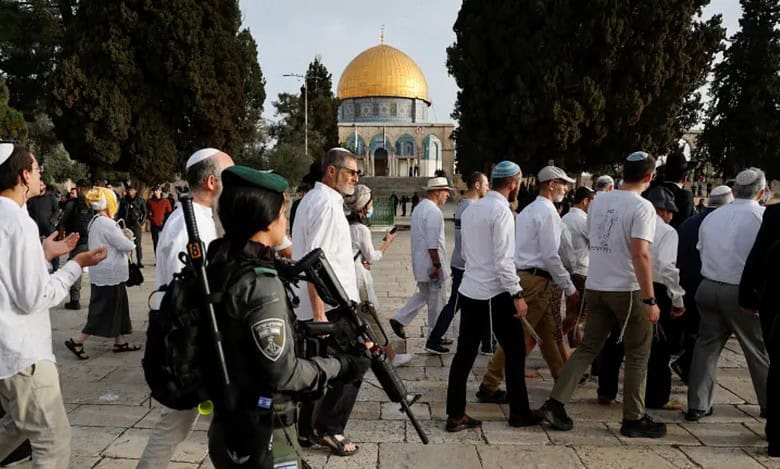 Israeli police escort Jewish settlers during a visit to the Al-Aqsa Mosque compound in Jerusalem’s Old City.