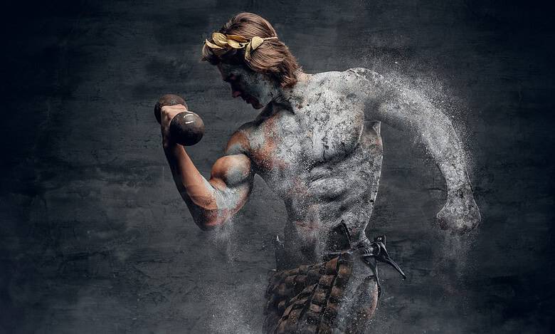 a bodybuilder posing in studio lighting