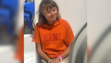 Greta Thunberg sits wearing an orange T-shirt with “Decolonize” printed on it after Israel intercepted the Global Sumud Flotilla boats.