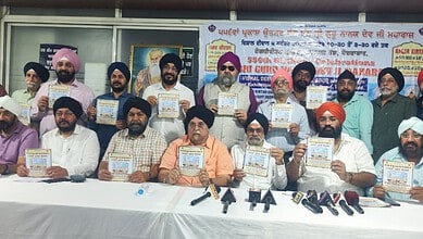 Members of Gurudwara Prabhandak committees release a brochure in connection with 556th Prakash Utsav (Birthday Celebrations) of Guru Nanak Devji.