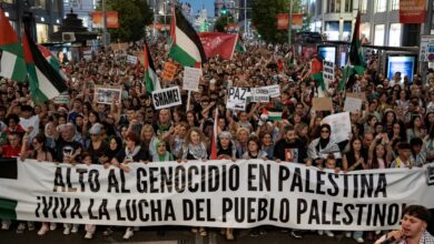 Thousands march in central Madrid holding Palestinian flags and banners during a protest in solidarity with Gaza.