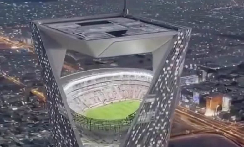 A digital image shows a football stadium inside the top of a tall tower in Saudi Arabia’s NEOM city.