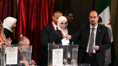 A member of Syria’s local committees casts his vote during the country’s interim parliament selection process in Damascus, October 5, 2025.
