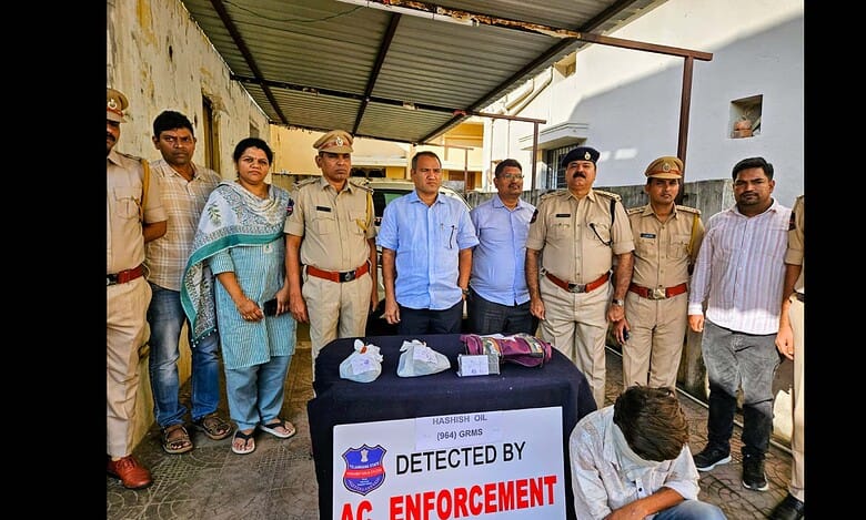 Telangana excise department officials display the seized hash oil