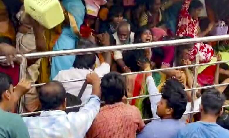 People gather at Venkateswara temple, at Kasibugga in Srikakulam district, Andhra Pradesh, Saturday. Atleast nine people were killed and two others suffered injuries after a stampede. (PTI Photo)