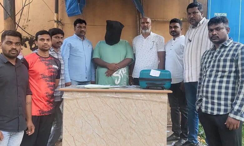 Ejaz Ahmed (face covered) was arrested by Hyderabad police for drug peddling