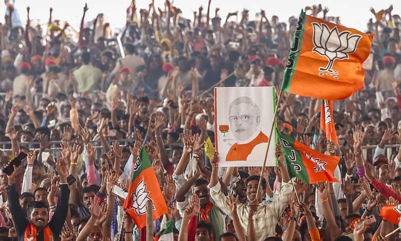 n this image posted on Nov. 3, 2025, Supporters hold a portrait of Prime Minister Narendra Modi during a rally ahead of the Bihar Assembly elections, in Saharsa. (narendramodi.in via PTI Photo)