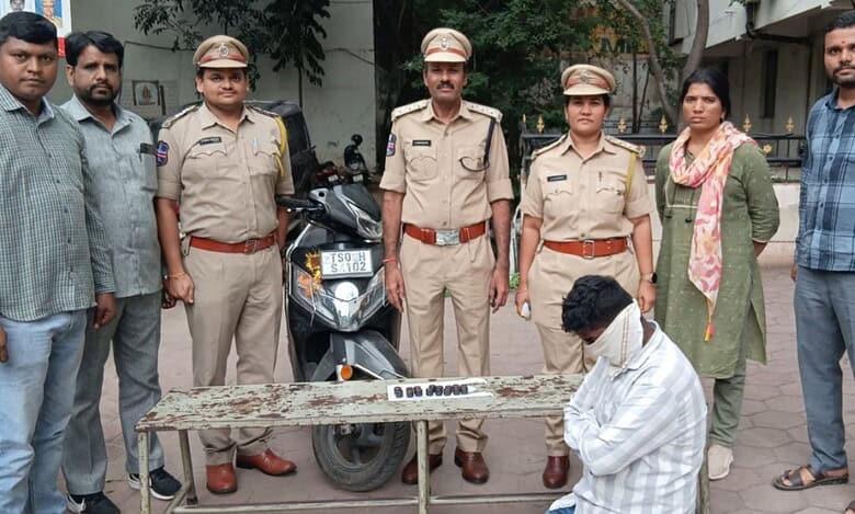 Telangana excise police along with the accused ( face covered) and Hash oil
