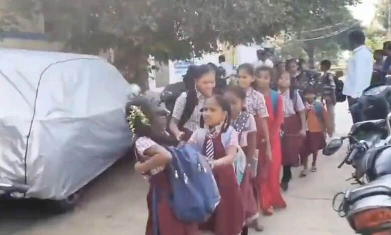 students walk in line after the government school was locked over non-payment of rent