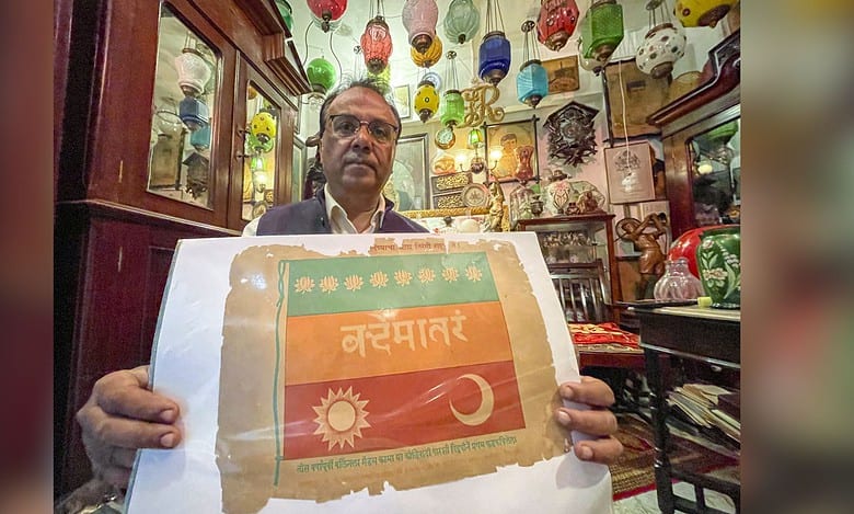 Antique collector Zafar Ansari displays a tricolour flag linked to the legacy of Vande Mataram, in Indore, Madhya Pradesh. (PTI Photo/Harshwardhan Prakash)