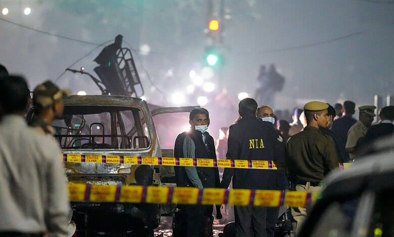 National Investigation Agency (NIA) team at the spot after a blast occurred in a parked car near Red Fort leaving multiple vehicles in flames on Monday. At least nine people were killed and 24 others suffered injuries in the incident. (PTI Photo/Salman Ali)