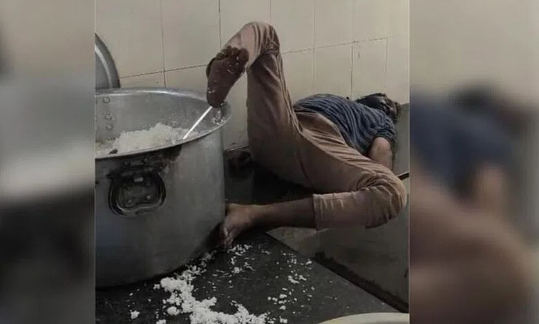 A watchman sleeps with his foot on the vessel in hostel in Telangana