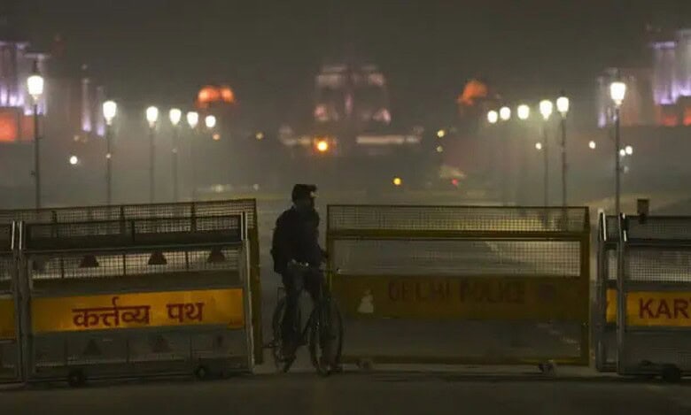 A Delhi police official inspects the blast site