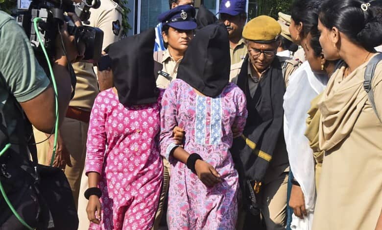 Vijayawada Police personnel with arrested Maoists in a coordinated intelligence-led operation in Andhra Pradesh. State Police arrested 50 CPI (Maoist) cadres across five districts. The crackdown coincided with an encounter at Maredumilli on Wednesday. (PTI Photo)