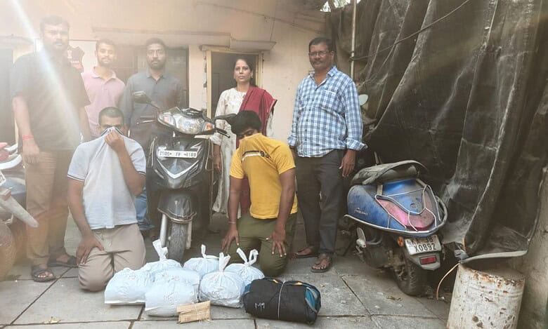 Excise police with two accused arrested for ganja peddling in Hafeezpet
