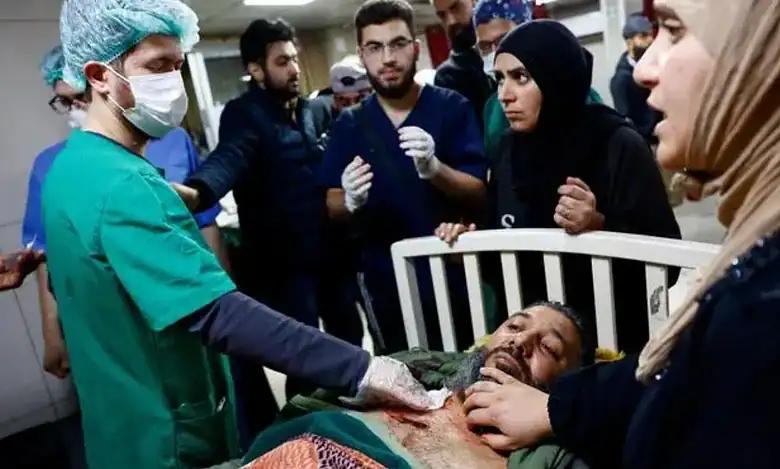 A wounded man receives emergency treatment at a hospital in Damascus after an Israeli raid in the Beit Jinn area of southern Syria on November 28.