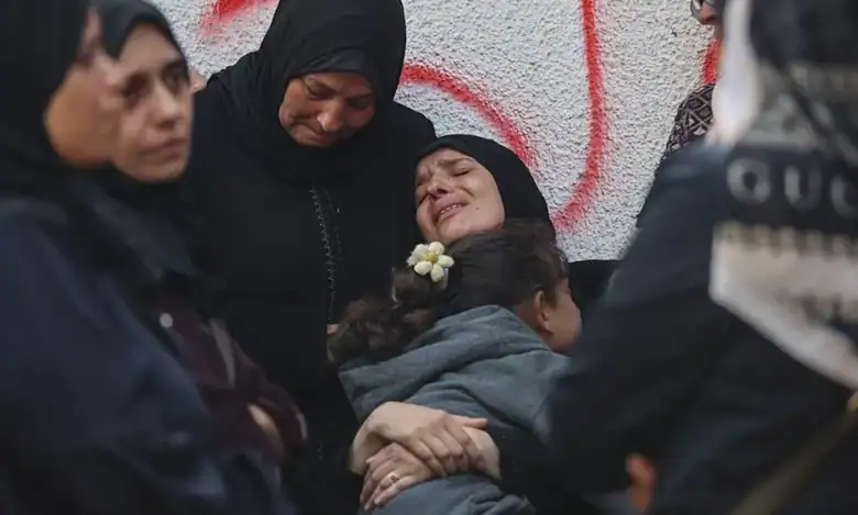 Mourners in Gaza grieve at al-Shifa Hospital after deadly overnight strikes.