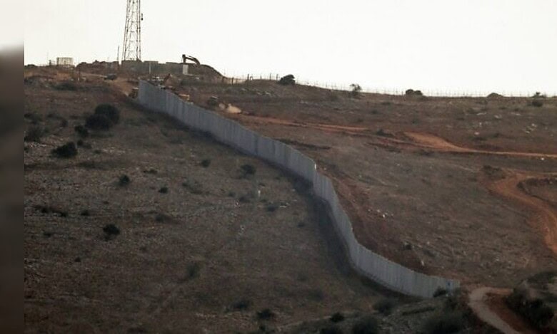 A concrete border wall built by the Israeli army along a hillside near the Lebanon–Israel boundary.