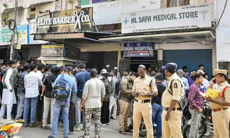 Crowd and police gathered outside a travel agency in Mallepally following news of a fatal bus accident involving Hyderabad pilgrims in Saudi Arabia.