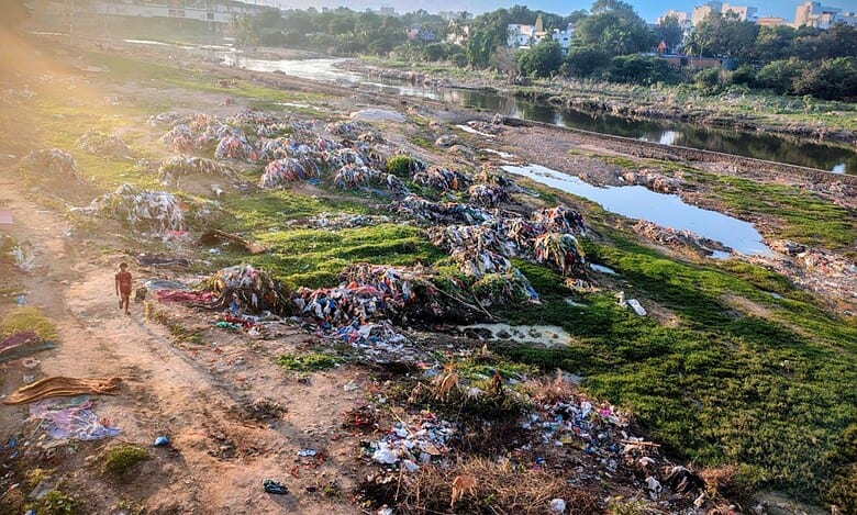 Garbage lined up near the Chaderghat bridge after heavy rainfall