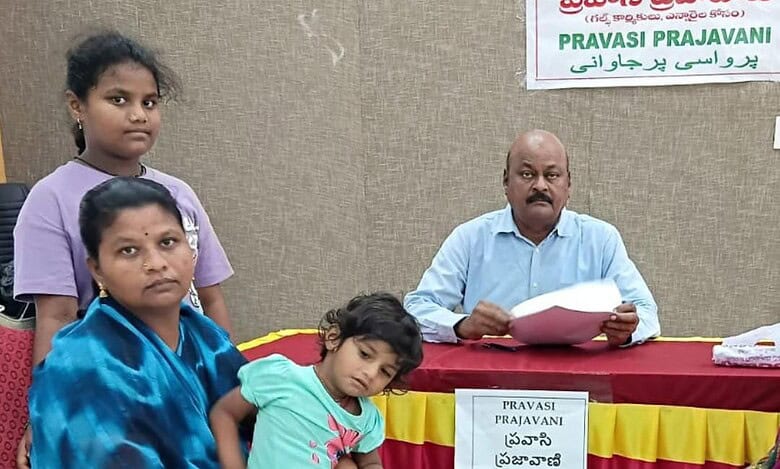 Prameela, wife of a Telangana worker killed in Dubai, sits with her children while meeting Telangana NRI Advisory Committee Chairman Manda Bheem Reddy during the Pravasi Prajavani programme.