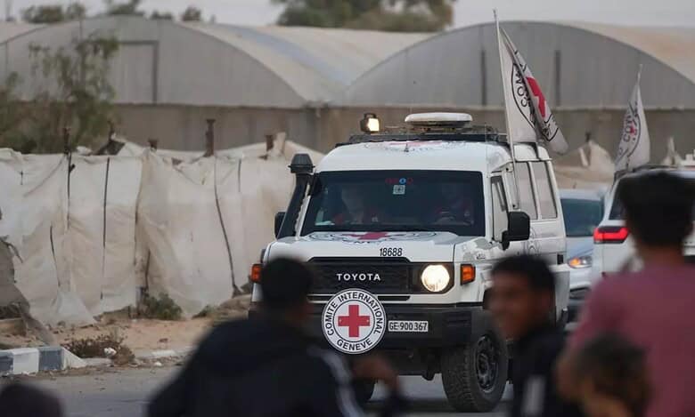 A Red Cross vehicle drives through Gaza carrying remains for transfer to Israel amid the ongoing ceasefire.