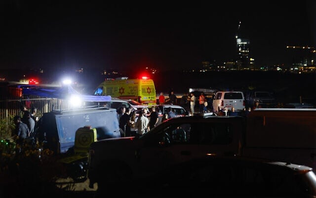 Rescue and police teams with emergency vehicles search the Tel Aviv shoreline at night during the operation to locate Yifat Tomer-Yerushalmi..